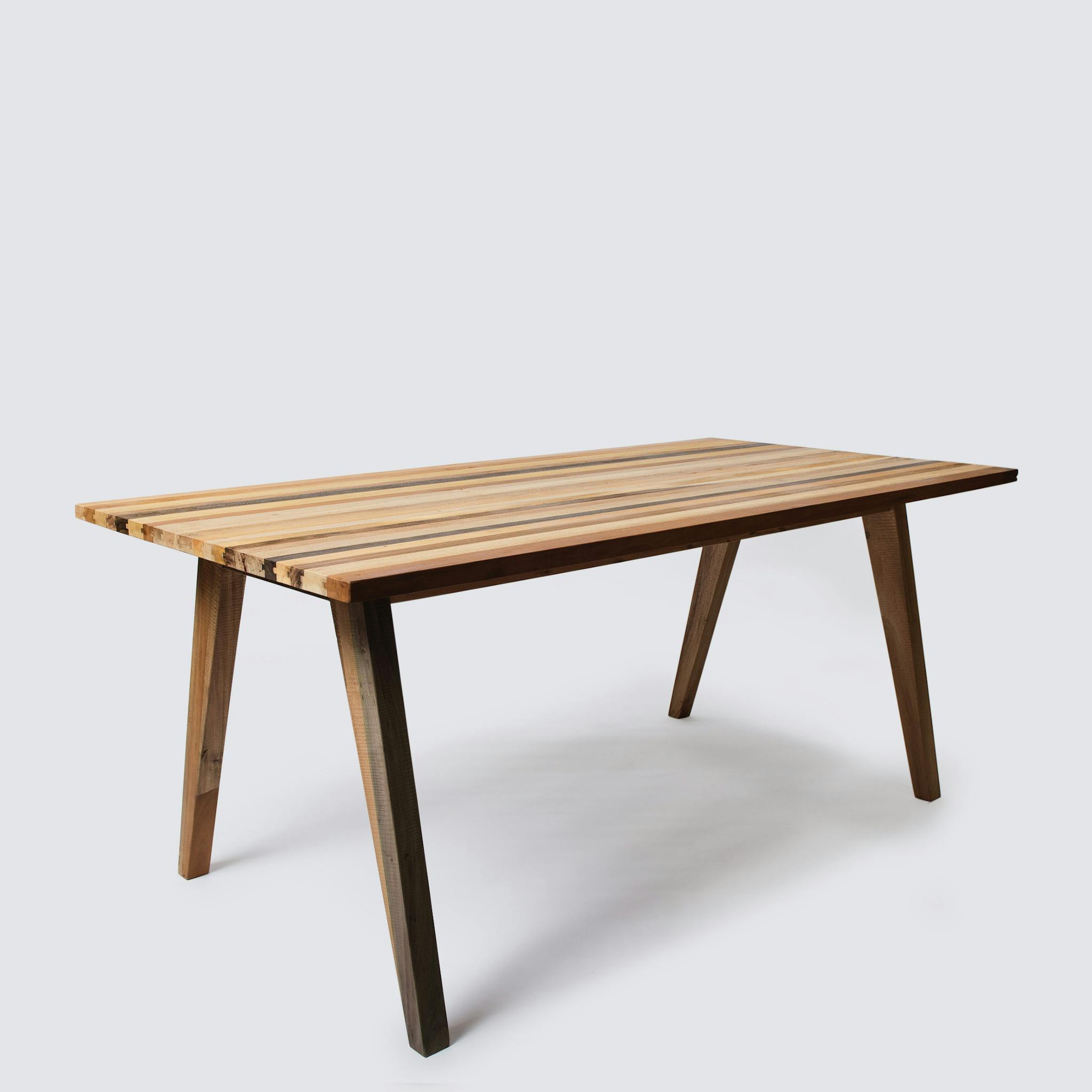 Elegant wooden table showcased on a clean white backdrop, highlighting minimalist design.